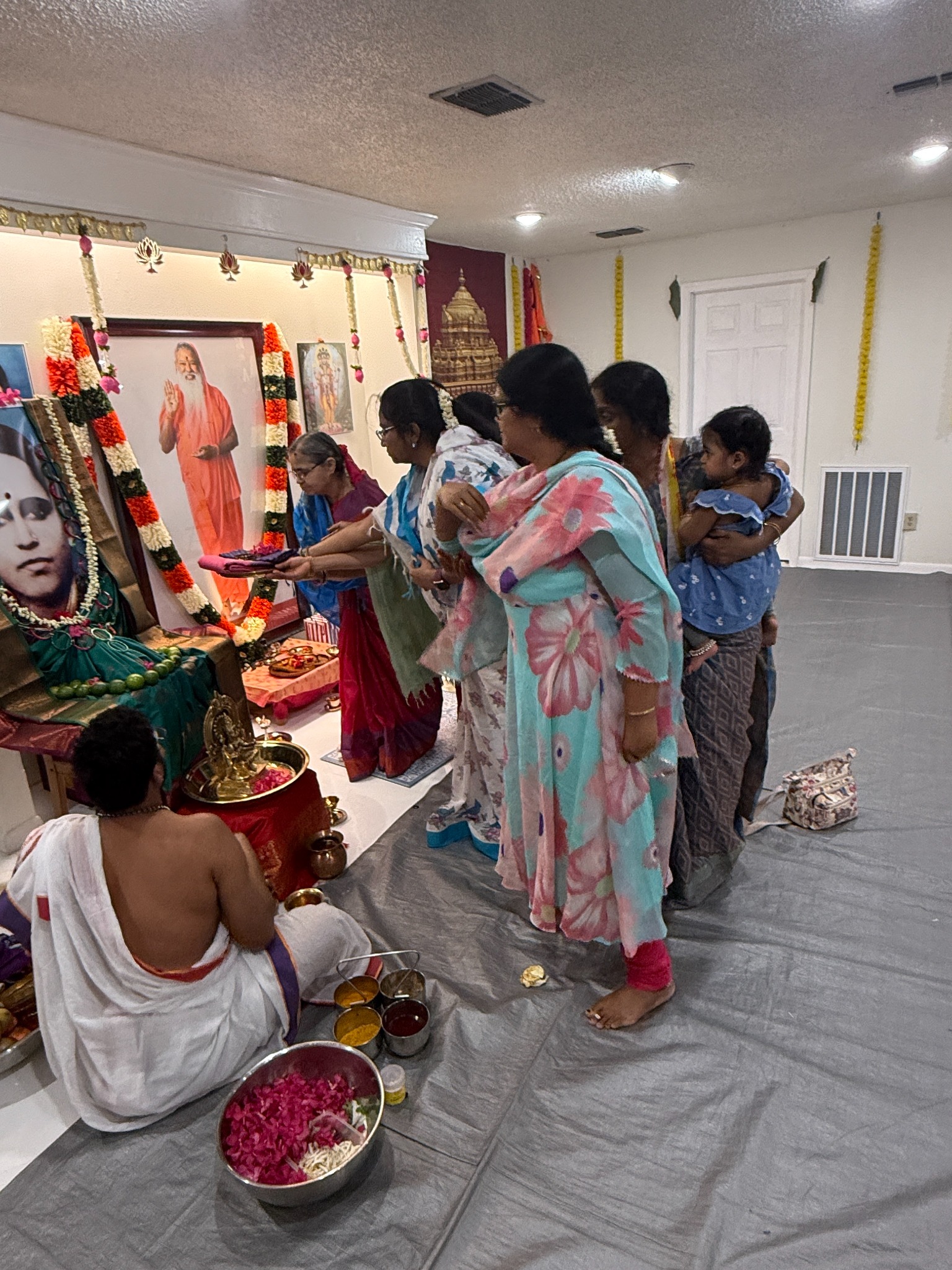 Devotees participating in Deepa Seva